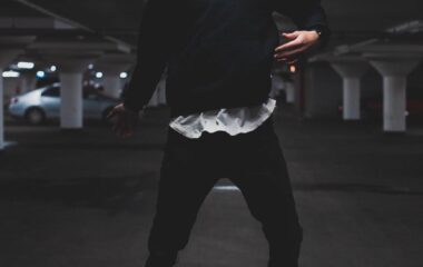 man jumping inside parking area