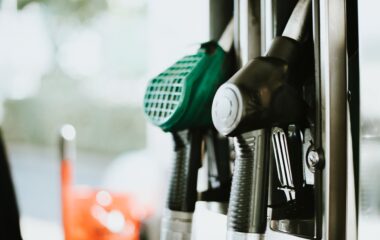 selective focus photography of gasoline nozzle