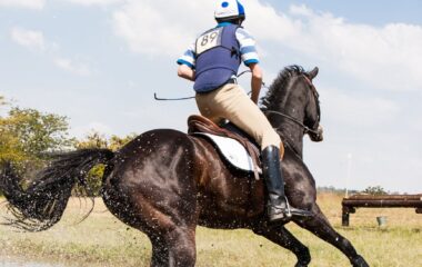 person horseback riding outdoors