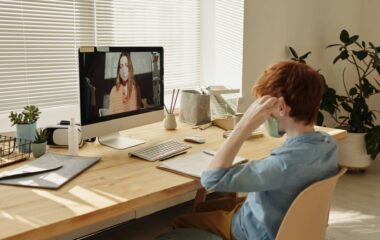 photo of boy watching through imac