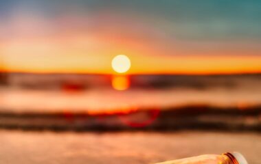 orange mason jar in body of water